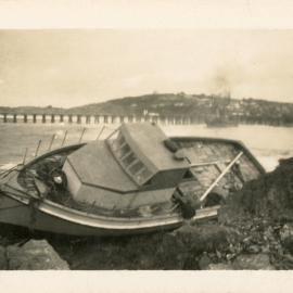 The Reliance Star rests against rocks on north wall after a cyclone, June 1950