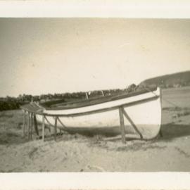 Stabilising a stranded fishing boat on Jetty Beach after a cyclone, 24 June 1950 