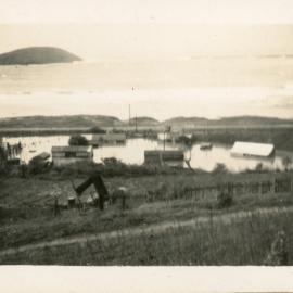 Flooded Coffs Harbour railway houses near the jetty after a cyclone, 25 June 1950 