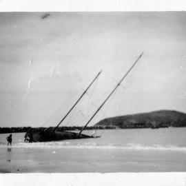 A beached boat in Coffs Harbour, 24 June 1950