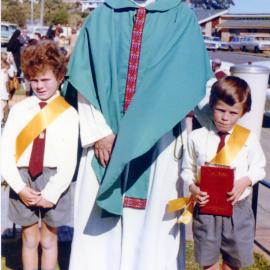 Danny Plunkett and Jim O'Gorman with Father Tony Casey at St Augustine's First Communion, 1974