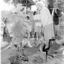 Loretto Carmichael planting a tree on the 75th anniversary of St Augustine's School, April 1988