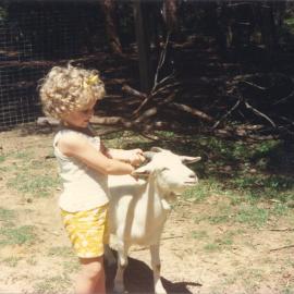 Leana McInnes & goat, Storyland Gardens, mid-1980s
