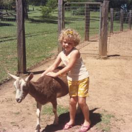 Leana McInnes & goat, Storyland Gardens, mid-1980s