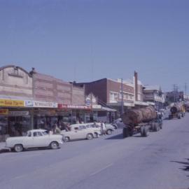 Procession of timber logs, Coffs Jetty, 1964