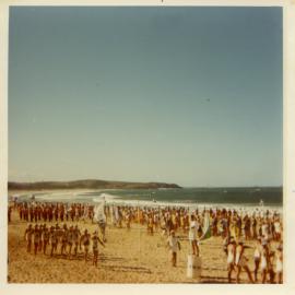 Lifesavers march past on Park Beach, 11 April 1970
