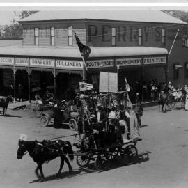 Procession Parade rounding the Perry Department Store, November 1918