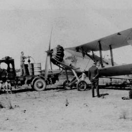  David Nicol refuelling an RAAF Westland Wapiti aeroplane at Coffs Harbour Aerodrome, 1930s