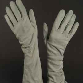 Pair of green embroidered gloves