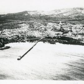 Aerial view of Woolgoolga township and jetty, mid-1940s