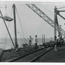 Loading timber at Woolgoolga Jetty, early 1900s