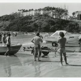 Motorboats and boat trailers at Woolgoolga Beach, 1980s