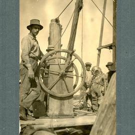 Jetty diver Jim Pearce in suit to inspect piles, c.1940s