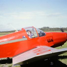 Pilot Dr Robin Jelliffe and passenger Susan Selby prepare for flight, 1977