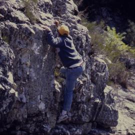 Man climbing rock wall