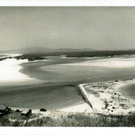 Beach houses and estuary, c. 1950s