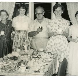 Jack Gerard admires his birthday cake, c. 1950s