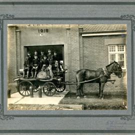 Fire Brigade members sitting on a horsedrawn fire engine, 4 February 1919 