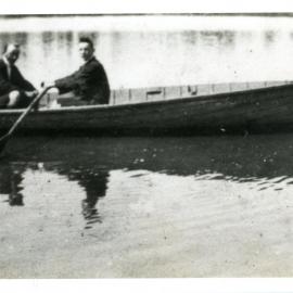 Two men in a rowboat, c. 1950s