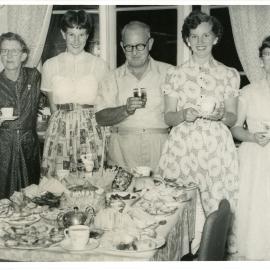Jack Gerard admires his birthday cake, c. 1950s