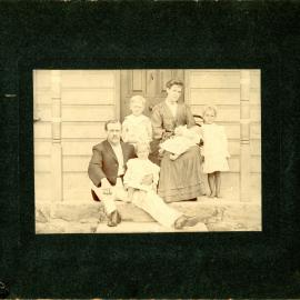 Family of six on the steps