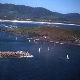 Hobie catamarans sail past the southern breakwall, 1977