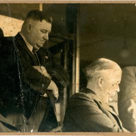 Harry Bailey listens to proceedings at the opening of the new B. G. F. building, 30 August 1951