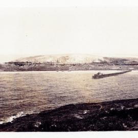 Jetty Beach and breakwall construction from Muttonbird Island, 1920s
