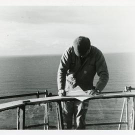 Checking the repair plan for the Smoky Cape lighthouse, 1977 