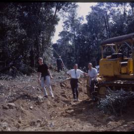 Three men and bulldozer, Mount Moombil, c. 1963