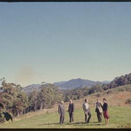 Group of people in field, c. 1966