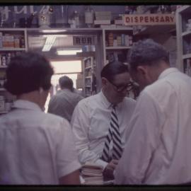 Arnold Forsyth in his pharmacy, c. 1960s