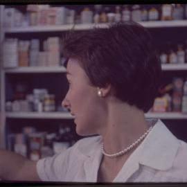 Pharmacy assistant in Forsyth's pharmacy, c. 1960s