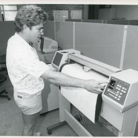 Engineer Ray Hallgarth with plotter, 1985