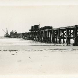 Timber transfer at the jetty, 1930s