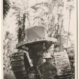 Man with crawler tractor, c. 1940s