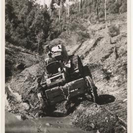 Tractor driving out of bog, c. 1940s