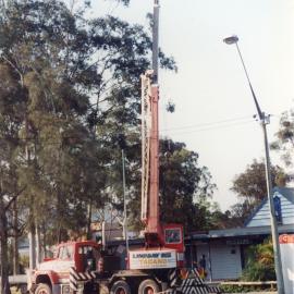 A Lindsay Bros crane lowers an anchor at the original Regional Museum, 6 October 1994