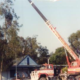 A Lindsay Bros crane lowers an anchor at the original Regional Museum, 6 October 1994