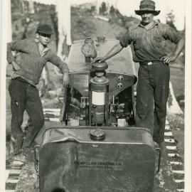 Workers stand on the Caterpillar, 1936