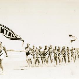 Surf life-savers march past