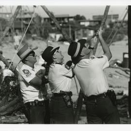 Police shake a tripod at the Look-At-Me-Now protest, November 1991