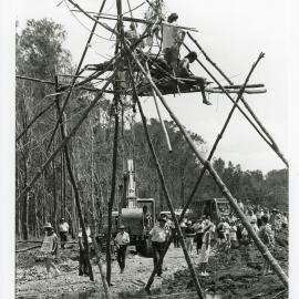 Police and machinery close in on a tripod at the Look-At-Me-Now outfall protest, November 1991