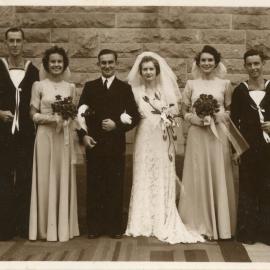 Portrait of a bridal party with naval officers