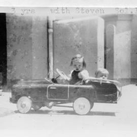 Linda Hobman and her brother Steven in their pedal car at Seal Rocks, 1954