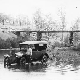 Car in a waterhole