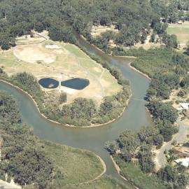 Aerial view of the developing Botanic Garden and Coffs Creek, August 1990