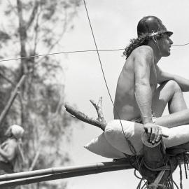 A protestor perches on top of a teepee, 25 November 1991
