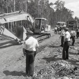 Heavy machinery rolls in under police guard, 25 November 1991