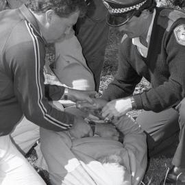 Police arrest a protestor, late 1991